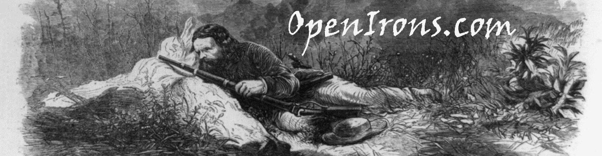 OpenIrons header image of California Joe peering out from behind a rock with his Sharps rifle in hand.
